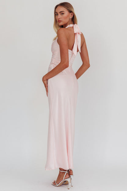 Halter neck front twist maxi dress in pink with open back and bow tie.