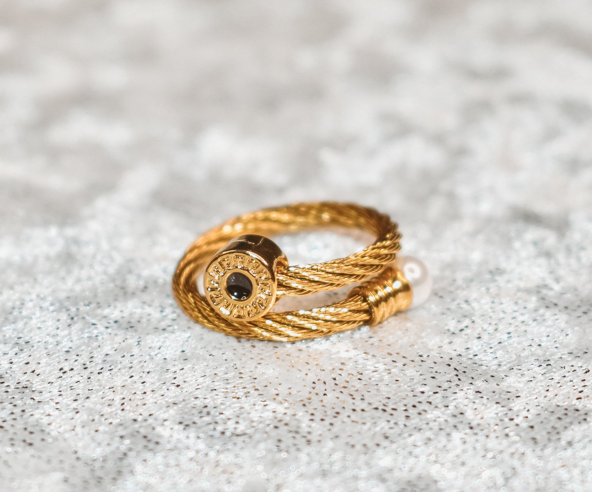 Gold cuff bracelet with ring