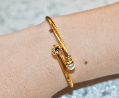 Gold cuff bracelet with ring